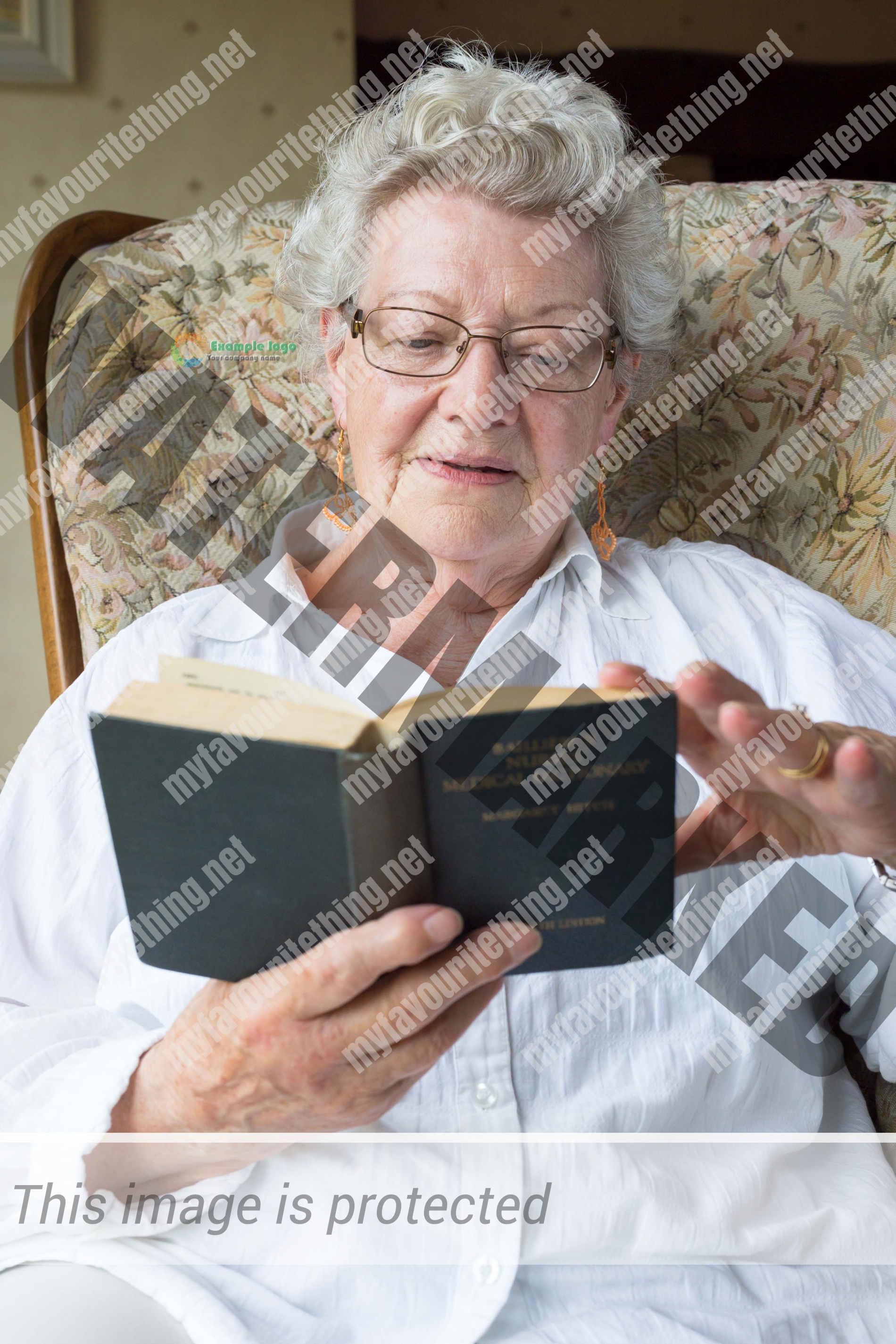 Retired midwife Betty MacKinnon with her book - Bailliere's Nurses Dictionary