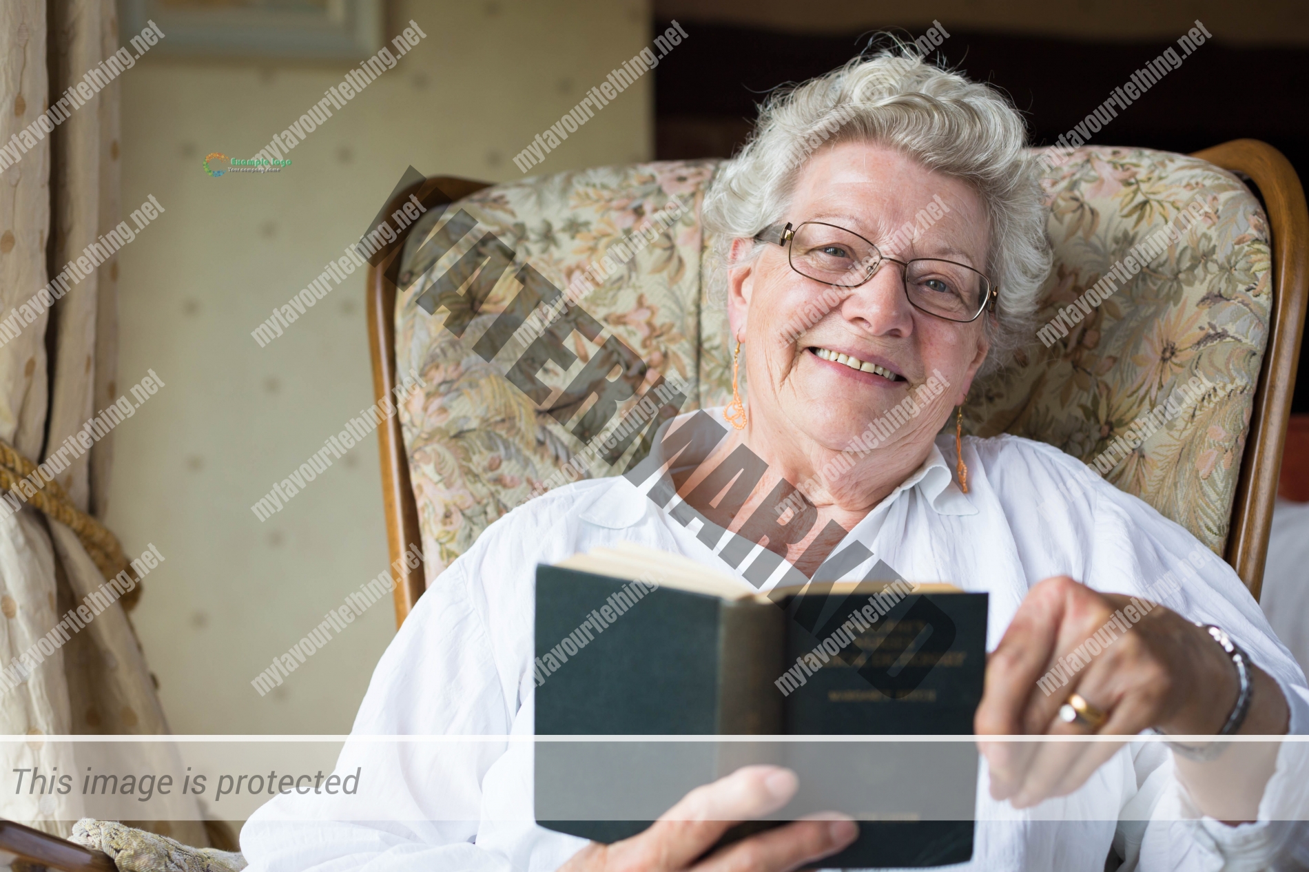 Retired midwife Betty MacKinnon with her Bailliere's Nurses Dictionary