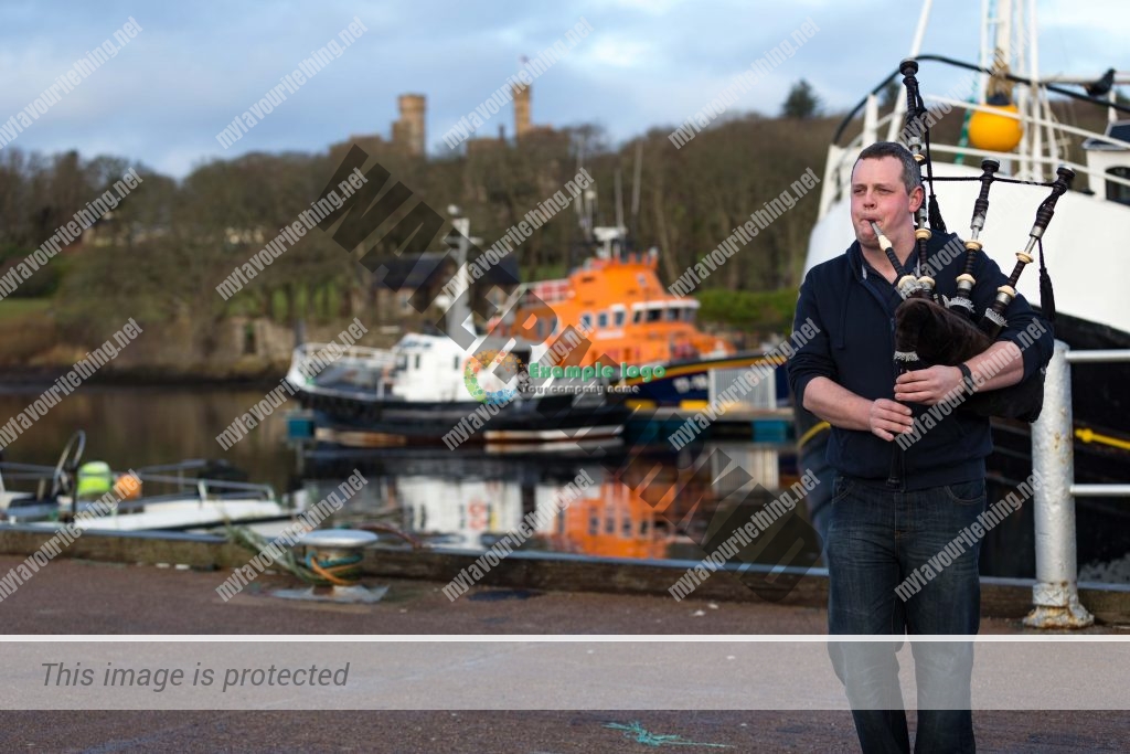 Ross Macrae playing bagpipes at Stornoway Harbour, Isle of Lewis